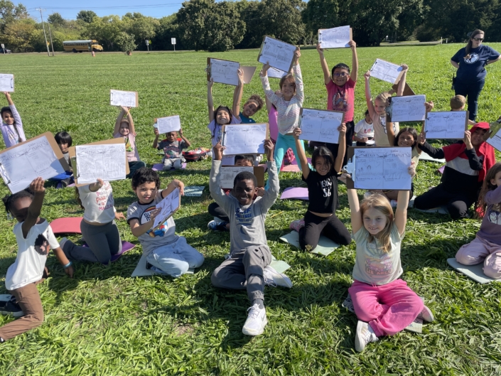 Students journaling about Lawn Lab